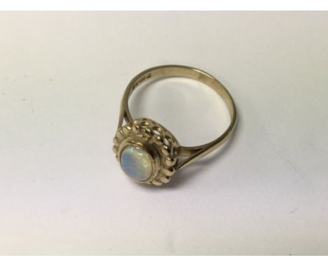 A 9 ct gold ring inset with opal size P - NO RESERVE