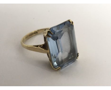 A 9ct gold ring set with a square aquamarine type stone.Approx N