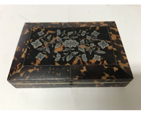 A sewing set including scissors thimble tape measure, fitted in a tortoiseshell box ,the hinged lid withMother of pearl flora