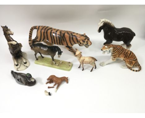 A group of ceramic animals including a USSR tiger and a Beswick fawn