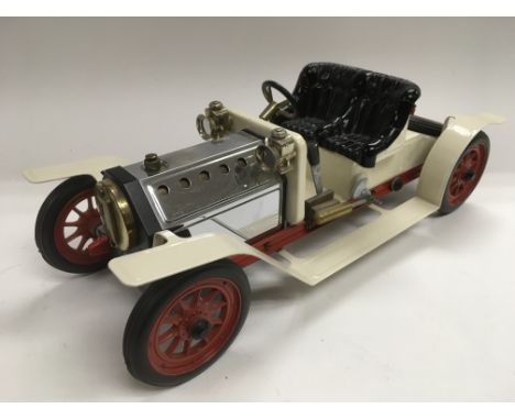 A Mamod model of a vintage car.