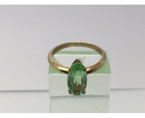 A 9ct gold peridot ring, approx 2g and approx size L-M.