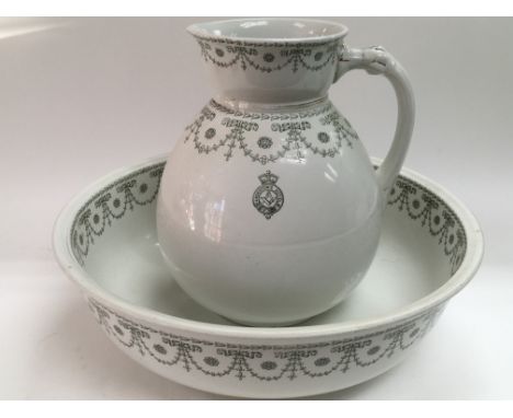 A Victorian jug and basin with a Masonic emblem.