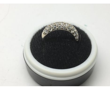 A silver ring set with CZs, approx 2.6g and approx size I.