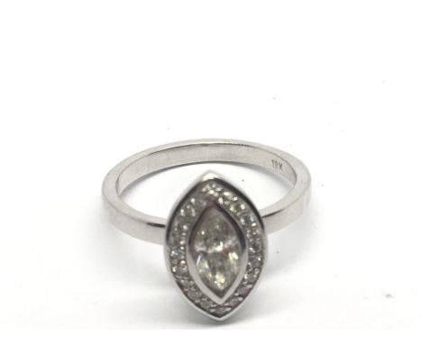 An 18carat white gold ring set with a Marquise diamond flanked by smaller brilliant cut diamonds.