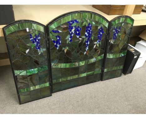 A glass firescreen with leadlight panels, approx 78.5cm x 121cm.
