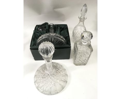 A boxed Thomas Webb decanter plus three other cut glass examples