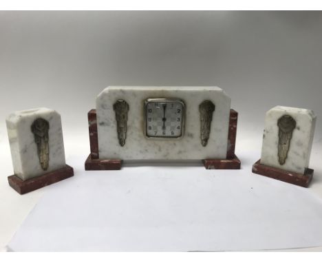 A marble Art Deco clock with side garnitures, incomplete movement and key,