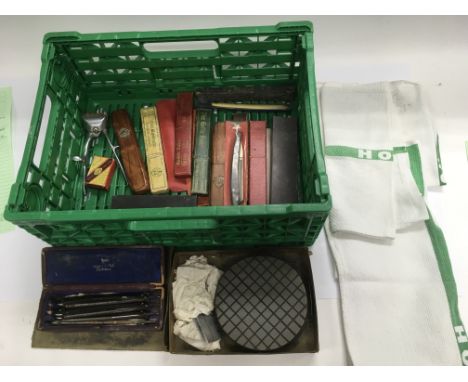 A collection of vintage barber shop items including towels and shaving equipment.