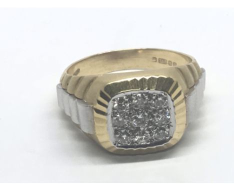 A Gents 18 carat white and yellow gold ring set with a pave of brilliant cut diamonds. Ring size T.