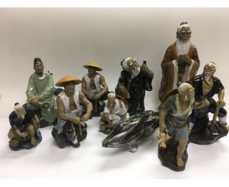 Nine modern Oriental ceramic figures and a Murano glass fish (10).