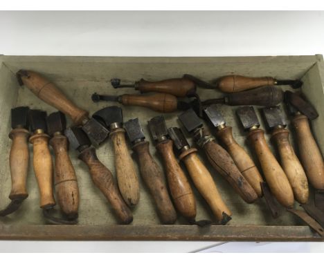 A set of 18 leather cobbler's tools.