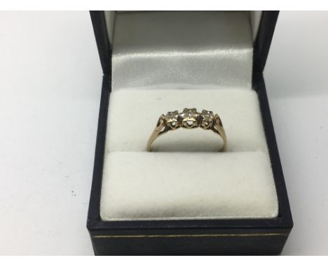 A 9ct gold three stone diamond ring, approx 1.4g and approx size P.