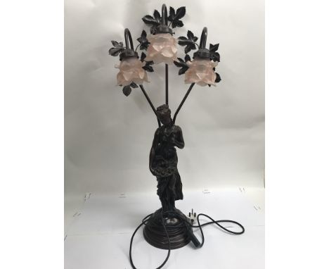 A Victorian style lamp in the form of a lady with a plate of fruit, with 3 flower petal style shades. Height approx 84cm.