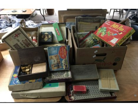 Two boxes of vintage toys including a magic set and jigsaw puzzles