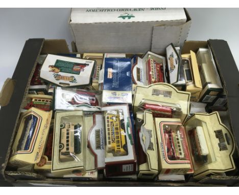 A box of Lledo die cast vehicles (boxed) and a collection of vintage board games.