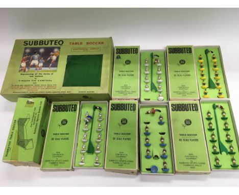 A vintage Subbuteo table soccer game and five teams.