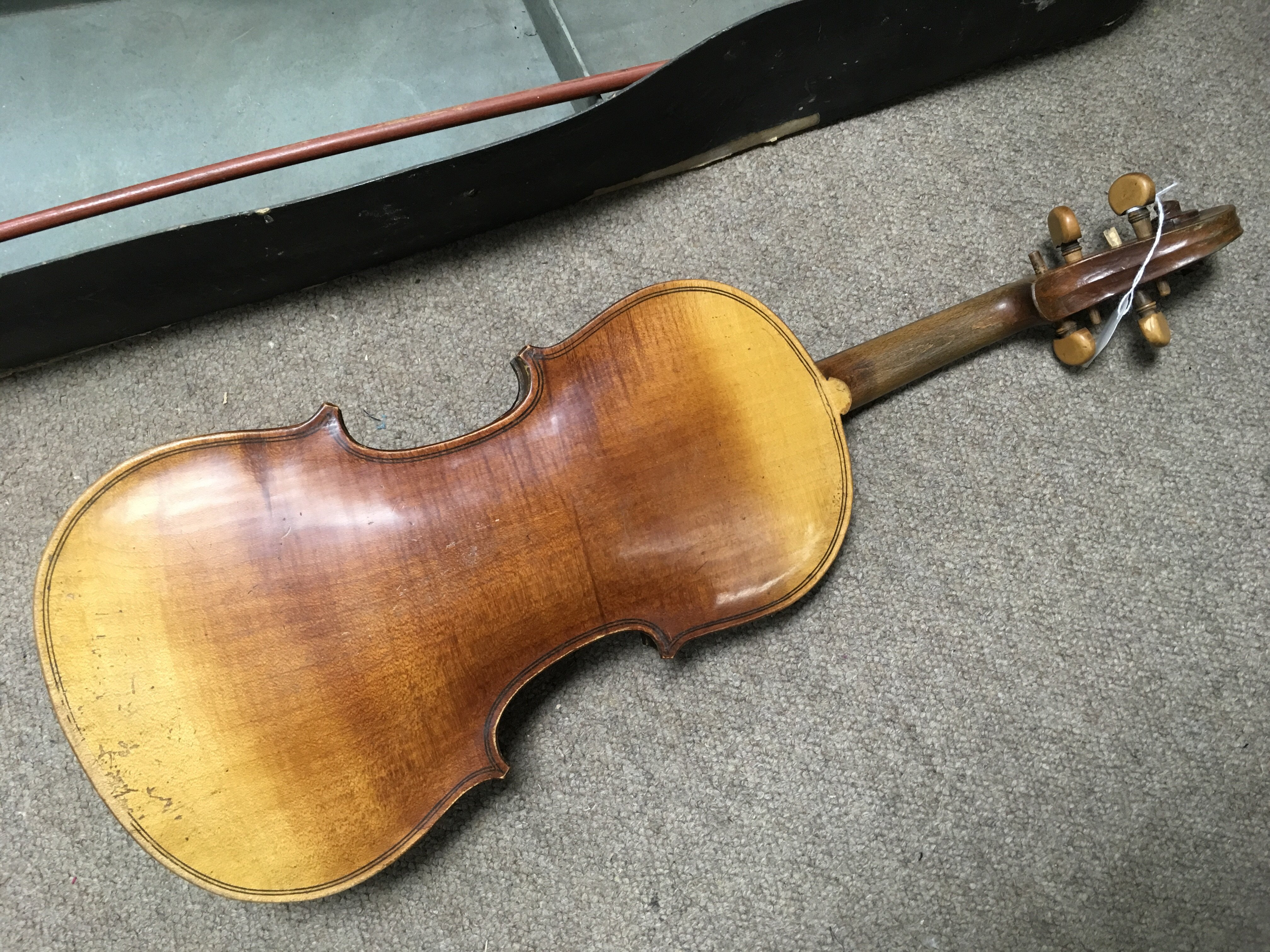 An old violin with pegs