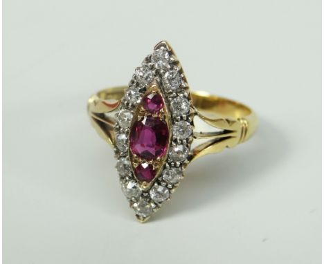 18CT YELLOW GOLD DIAMOND AND RUBY MARQUISE CLUSTER RING. 4 grams approximately. Condition Report: In good overall condition, 