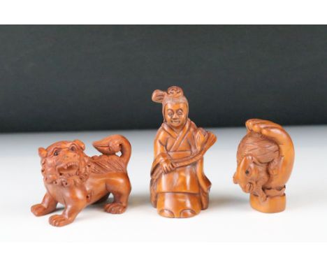 Three Signed carved wood netsuke figures to include goat in hand, Geisha girl and Chinese dragon