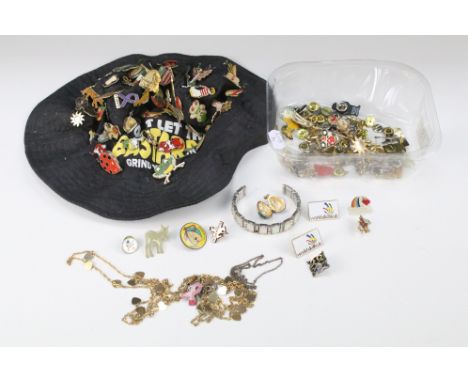 Large collection of mainly enamel badges and pin badges including Disney, countries and places, some pinned on a hat, togethe