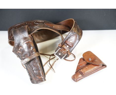 Black leather Western gun belt and gun holster and leather Walther PPK Pistol holder, complete with gun magazine