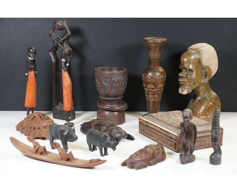Collection of African tribal art to include wooden face wall plaques, carved wooden jewellery box with inlaid parquetry, fert
