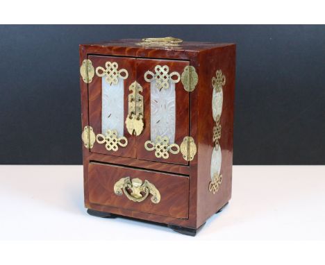 Chinese lacquered and brass mounted jewellery cabinet, the doors and sides inset with carved pierced jade panels, opening to 