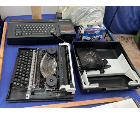 Two ZX Spectrum+3 computers (sold as seen, untested) together with a racing car, typewriter etc 