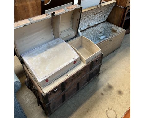 A domed top trunk, with a fitted  interior together with another domed top trunk