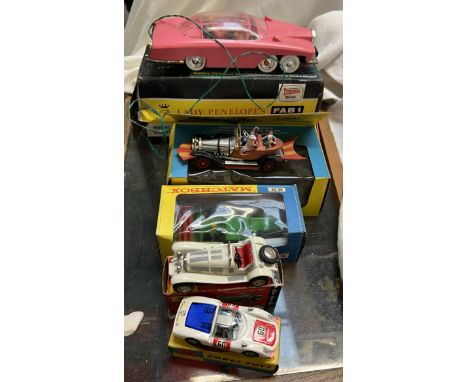 A collection of model vehicles including a Schuco Mercedes TYP SSK micro racer, a Corgi toys Porsche Carrer 6, a Matchbox K-9