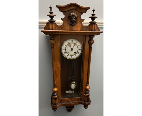A Vienna regulator type wall clock, with an enamel dial with Roman numerals 
