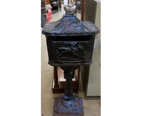 A cast iron post box with a caddy top and crown surmount on a pedestal and rectangular base, 112cm high 