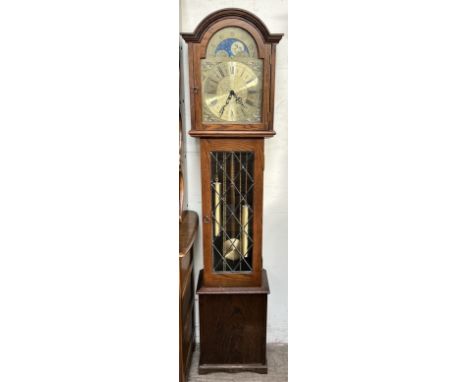 A modern Fenclocks longcase clock, with a moonphase dial, and a leaded glazed door