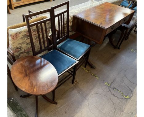 A reproduction mahogany sofa table with a crossbanded top with drop flaps on lyre ends and splayed legs together with a pair 