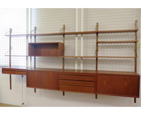 Poul Cadovius (1911-2011) A teak modular wall system comprising cupboard compartments and bookshelves, produced by Cado, 1960