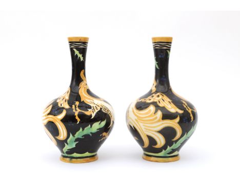 Carel Adolph Lion Cachet (1864-1945) A pair of ceramic vases decorated with griffons in orange on a black ground, produced by