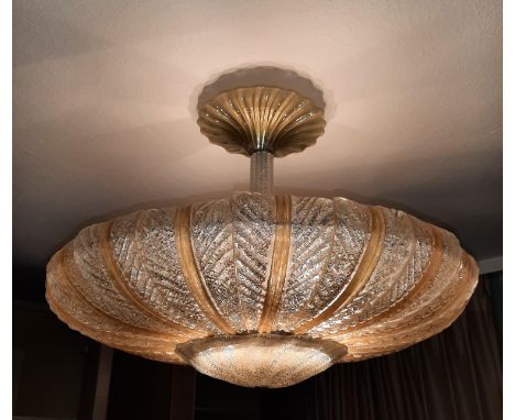 Midcentury Modern A Venetian glass and metal ceiling lamp, the shade composed of leaf-shapes in clear and amber colour, 1950s