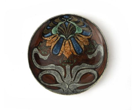 N.V. Haagsche Plateelfabriek Rozenburg, Den Haag (1883-1917) A ceramic wall plate decorated with stylized floral pattern on r
