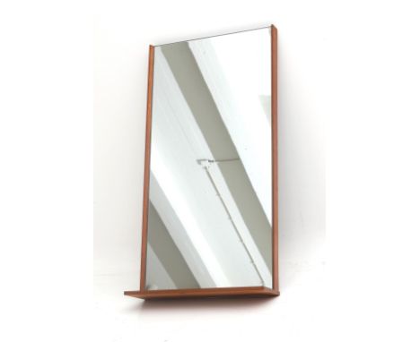 Midcentury Modern A rectangular wall mirror with teak frame and integrated shelf, 1950s. 92 x 47 x 15 cm. (hxwxd)