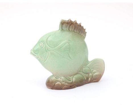 Potterie Kennemerland, Velsen A green glazed moulded ceramic figure of a fish, designed by Karl Gellings, 1930s, unmarked, mi