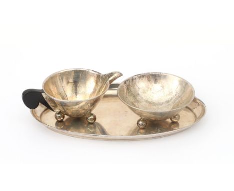 Kaeser &amp; Uhlmann, Schwäbisch Gmünd A .835 German silver hammered creamset, comprising an oval tray, a milkjug with ebony 