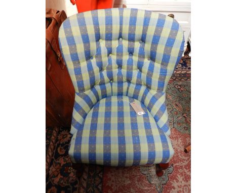 A Contemporary button upholstered spoon back chair, upholstered in a blue and green striped fabric, raised on carved cabriole