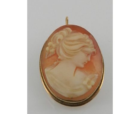 A late Victorian Continental 18ct yellow gold mounted shell carved cameo brooch, decorated with a head and shoulder portrait 