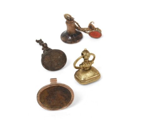 ~ A Collection of Seven Gilt-Metal, Blue John or Steel Fob-Seals, the gilt-metal examples carved with: the arms of Gresley im