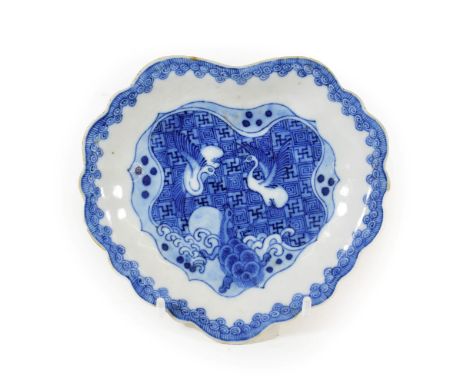 A Chinese Porcelain ''Ko-Sometsuke'' Dish, mid 17th century, of fluted leaf shape, painted in underglaze blue with birds abov