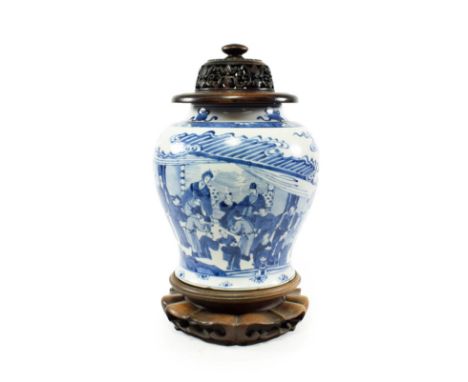 A Chinese Porcelain Jar, Kangxi, of baluster form, painted in underglaze blue with dignitaries and attendants in a garden, 22