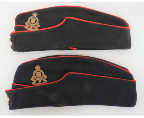 Two RAOC Coloured Field Service Caps dark blue crown, body and curtain with red piping. &nbsp;Front, brass General Service bu