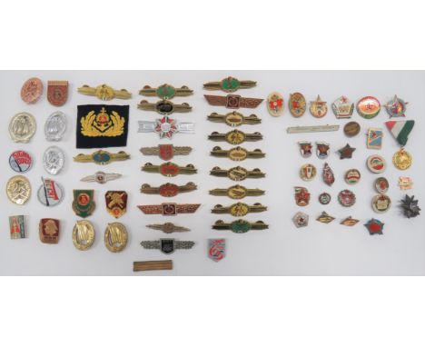 Eastern Bloc Badges including various East German Qualification bars including Transport ... Armoured ... Medical ... Missile
