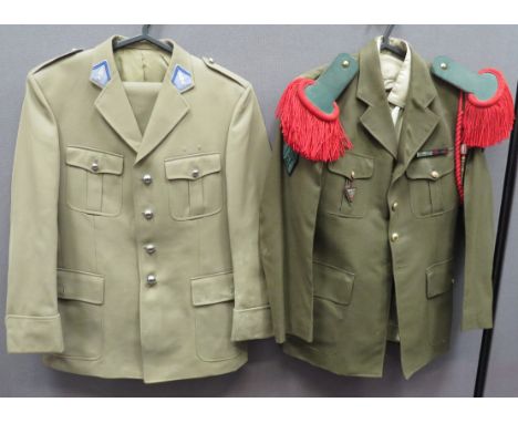 French Officer's Uniform khaki tan, single breasted, open collar tunic. &nbsp;Blue collar tabs with embroidery flaming grenad